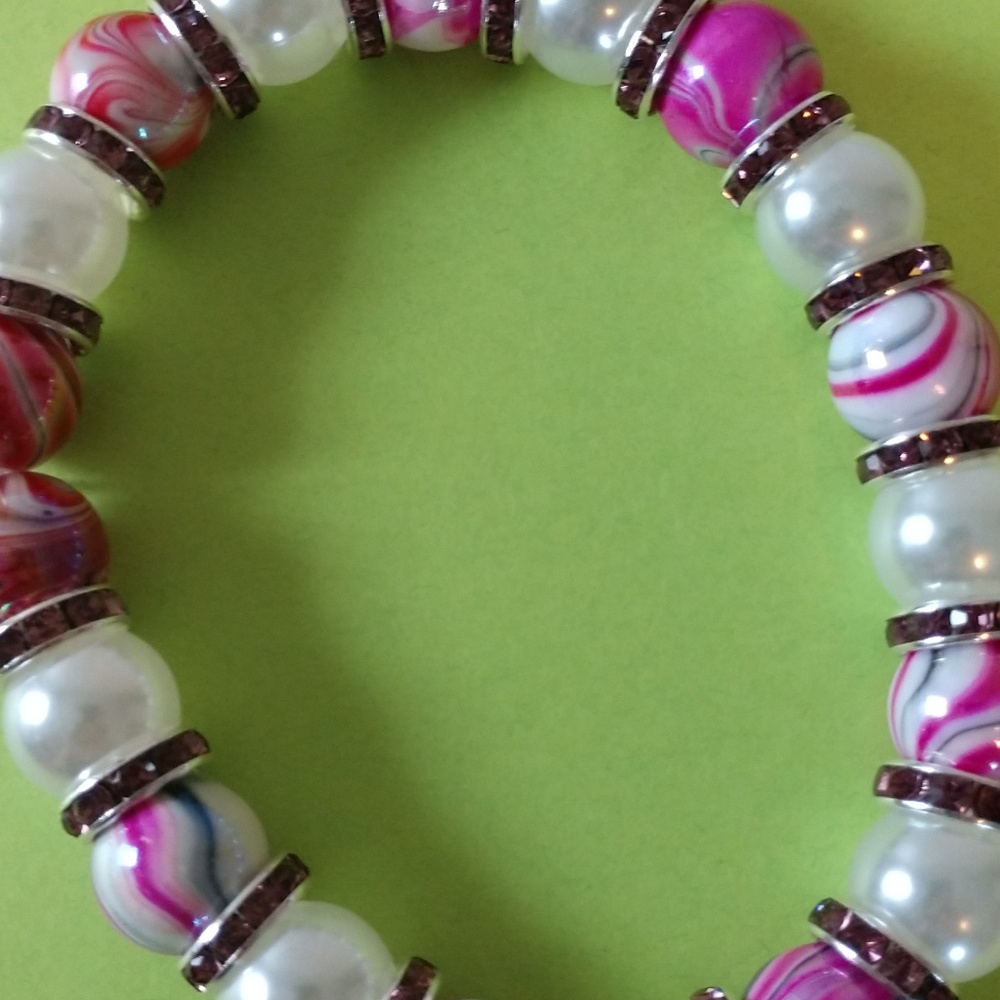 hand made bracelet with different colors on it